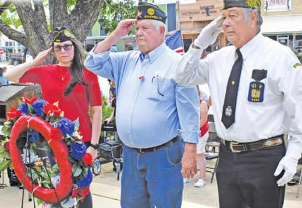 PLACING THE MEMORIAL Day Wreath at the Burleson County War Memorial were, from left, Tina Smith, Donny Wood and Tommy Miles.