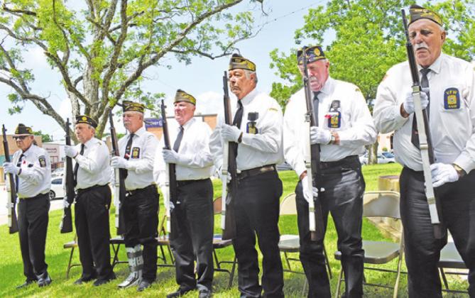 THE CALDWELL VFW RIFLE Honor Guard fired a three-rifle volley at the annual Memorial Day ceremony at the Burleson County War Memorial. -- Tribune photo by Roy Sanders