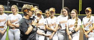 CALDWELL SOFTBALL COACH Wendy Weiss addresses the current Lady Hornets during a speech Friday night. Weiss was honored after the Caldwell-La Grange game for her 29 years of coaching in Caldwell.
