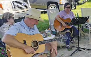 STEVE LOCKE AND Stacy Crocker perform on Sunday, May 19, at the Song Circle outside Front Street Burgers in Chriesman. Musicians and visitors are welcome at the gatherings, usually every other weekend.